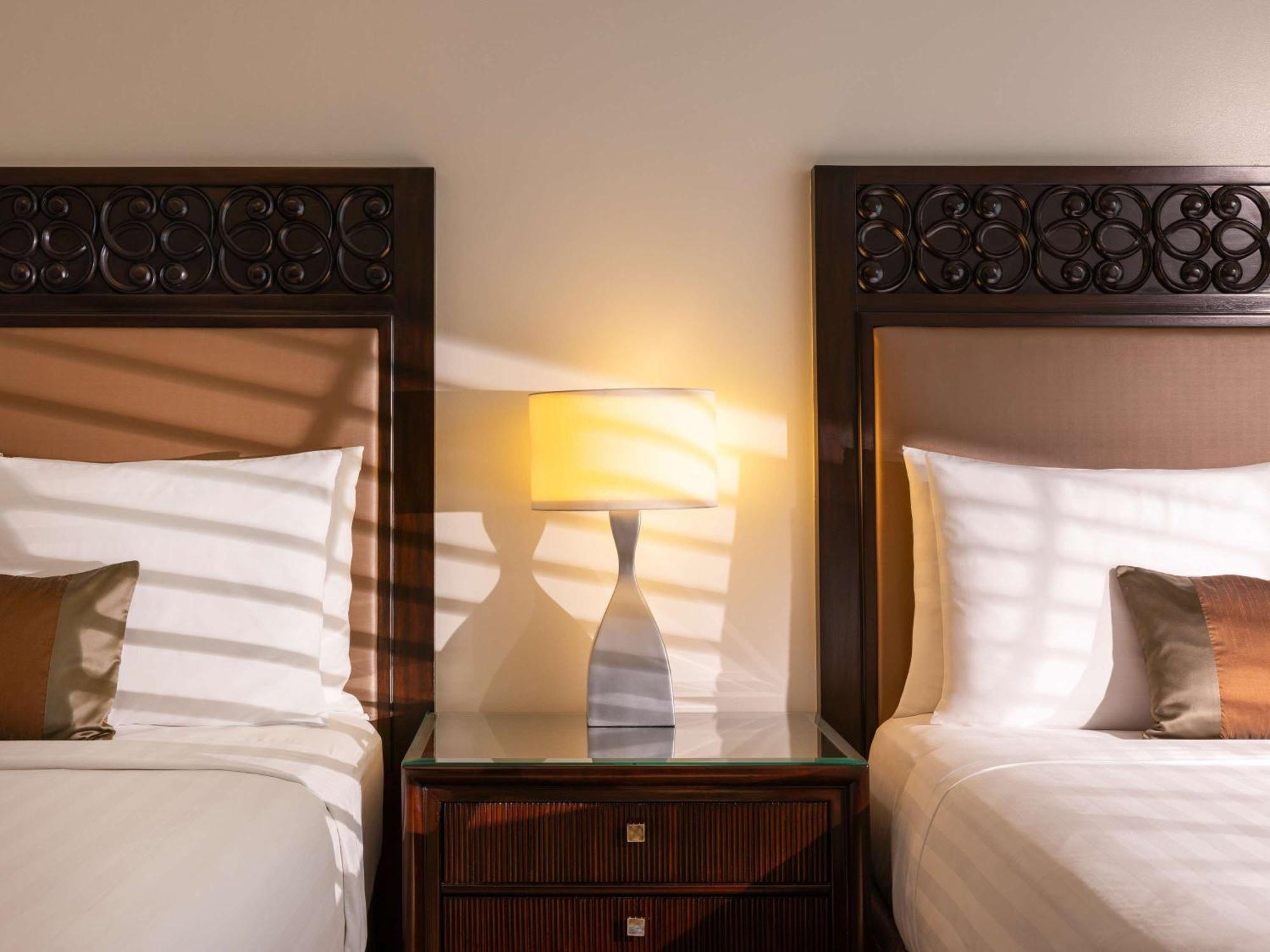 Fairmont Makati Hotel Makati City Exterior photo A lamp on a nightstand