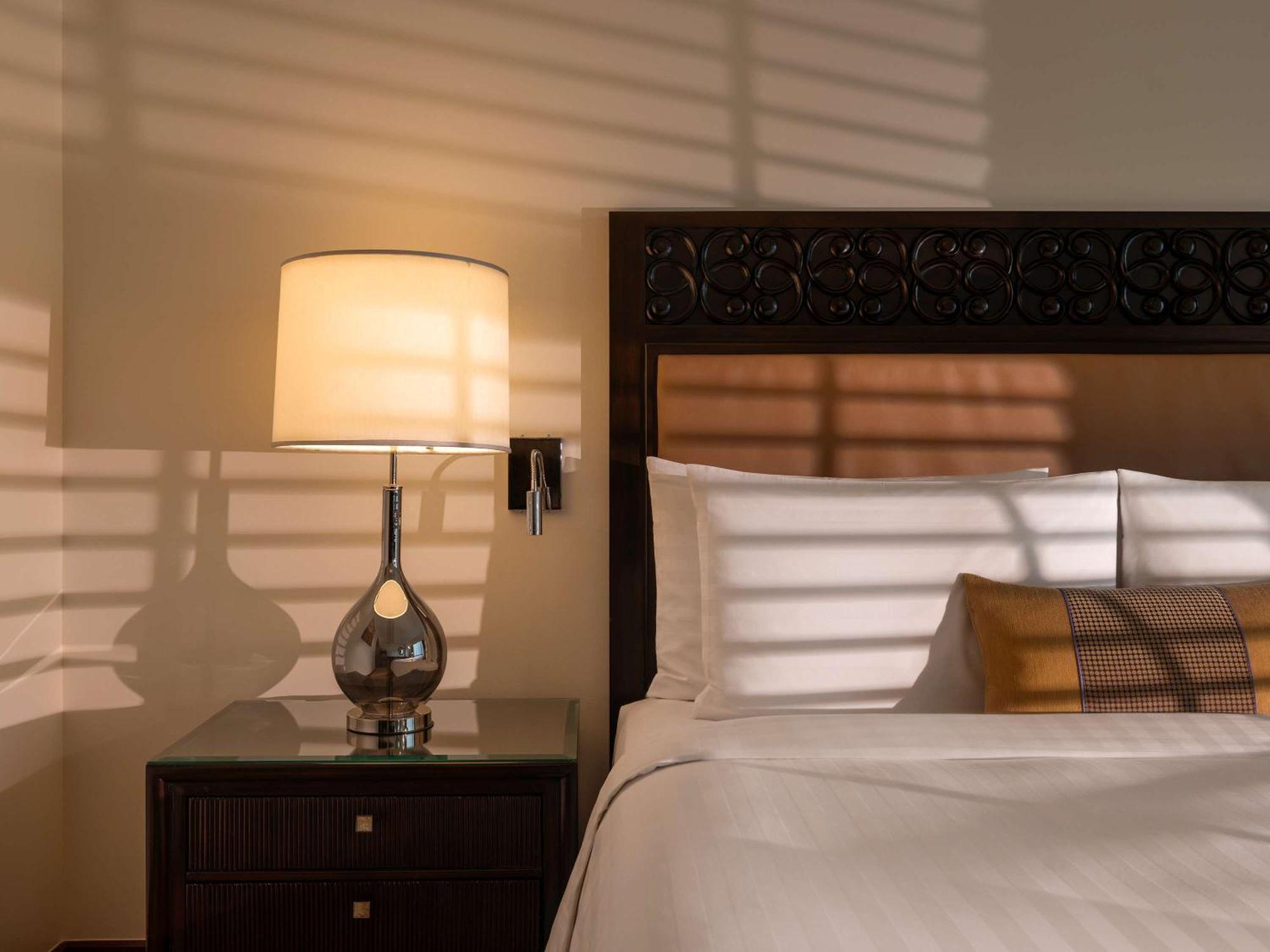 Fairmont Makati Hotel Makati City Exterior photo A lamp on a bedside table